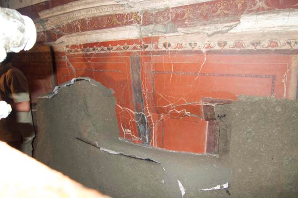 Villa dei Papiri, Herculaneum. July 2010. Room (I) on lower terrace, lower east wall of hall. 
This wall has regained some of its painted plaster in the four minutes since the photo of the antechamber east wall shown above. 
Photo courtesy of Michael Binns.
According to Guidobaldi and Esposito, the stuccoes have been excavated thanks to the constant and essential support of the restorers, who isolated and recovered each single fragment and at the same time consolidated and cleaned the surface of the stuccoes and of the paintings that were progressively unearthed during the excavation of the vault and the walls.
See Esposito D. and Guidobaldi M., 2010. New Archaeological Research at the Villa of the Papyri, in the Villa of the Papyri at Herculaneum. Berlin: De Gruyter, p. 34 note 28. 
 
