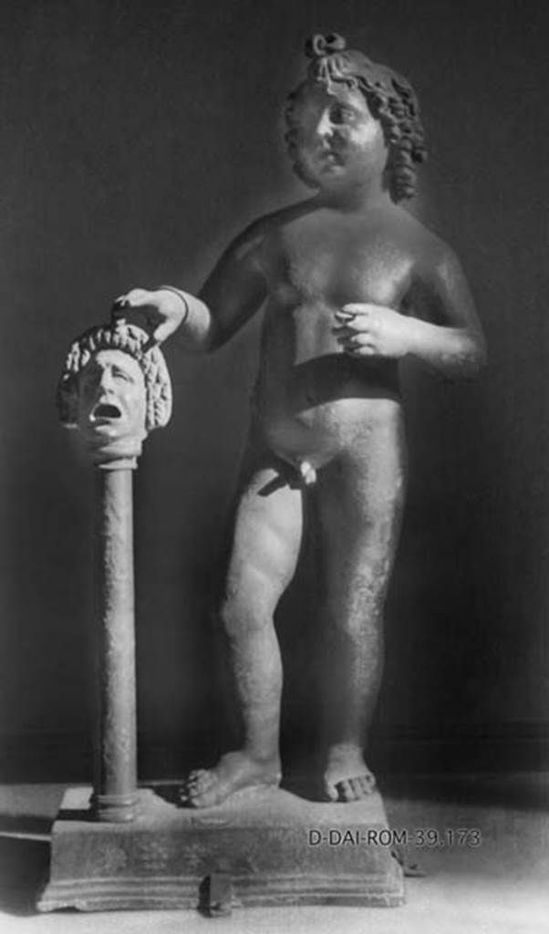 Villa dei Papiri, Herculaneum. Atrium. Bronze statue of cupid with right hand on mask found in 1754 round the impluvium.
DAIR 39.173. Photo © Deutsches Archäologisches Institut, Abteilung Rom, Arkiv. 
Now in Naples Archaeological Museum. Inventory number 5030.
